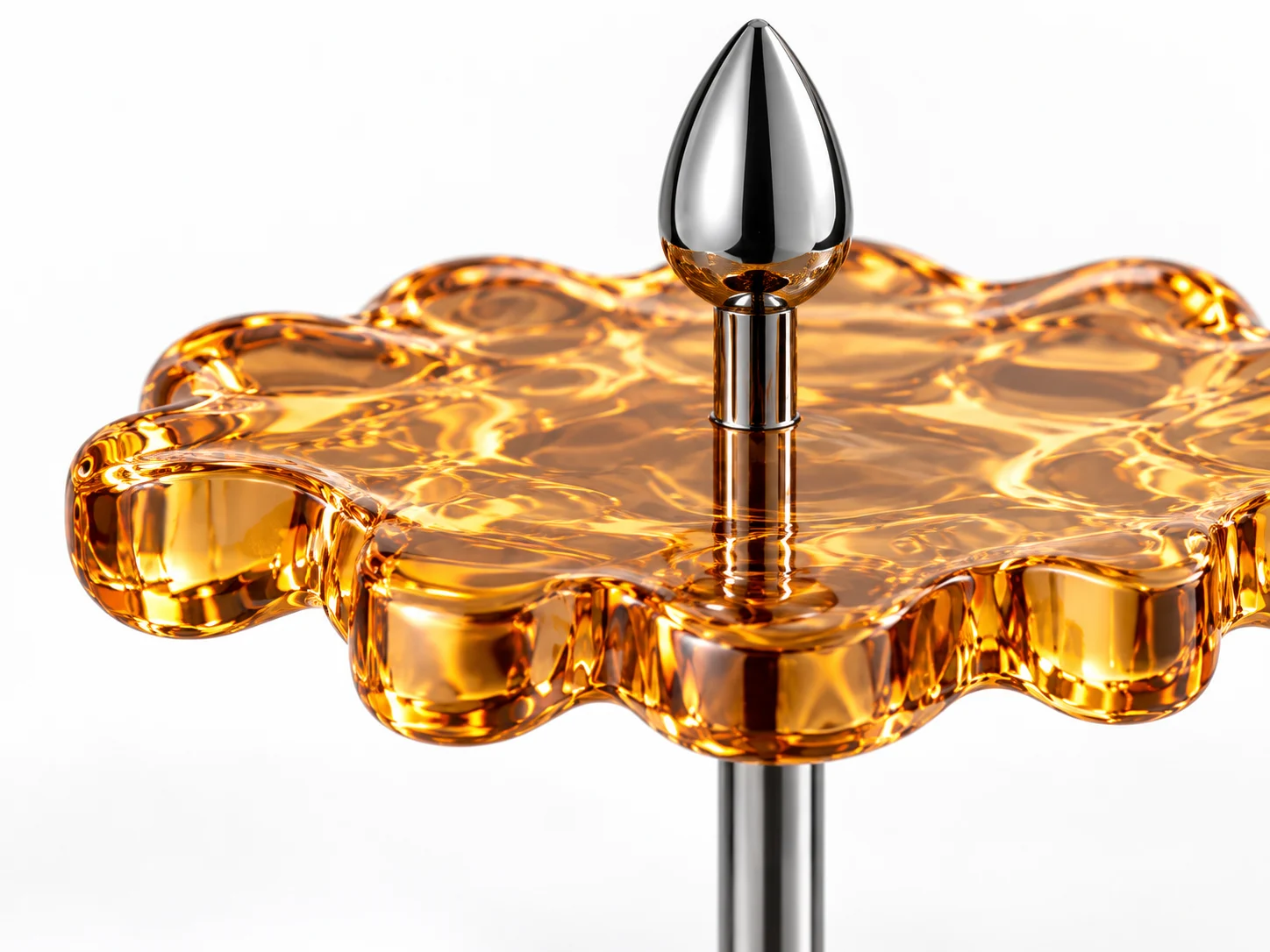 Detailed study of the amber scalloped seat edge and polished chrome joint